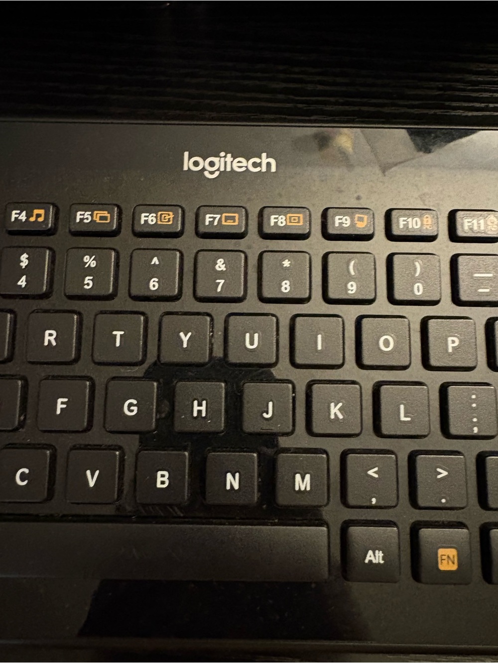 Logitech Black Compact Keyboard with Orange Function Icons